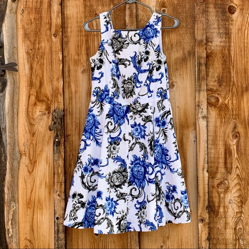 White dress with blue and black floral pattern